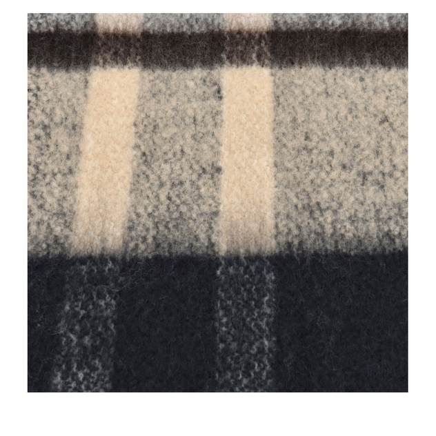 Detailansicht eines flauschigen Karostoffs in Grau, Schwarz und Beige